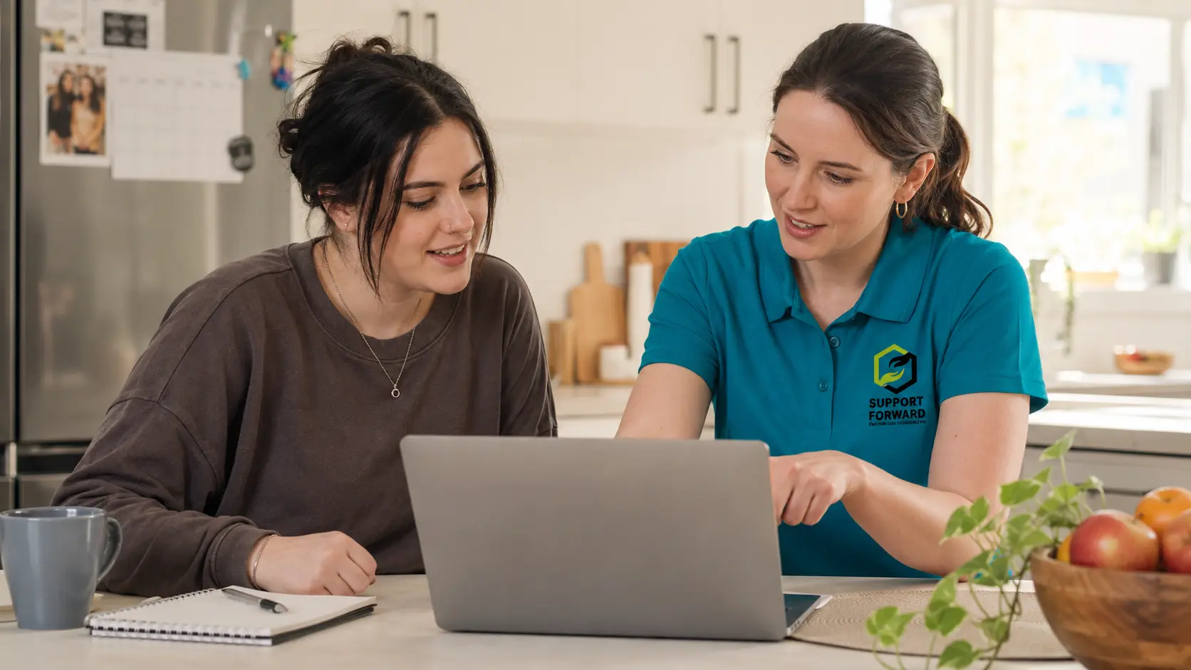 Life skills development — participant learning budgeting skills with support worker